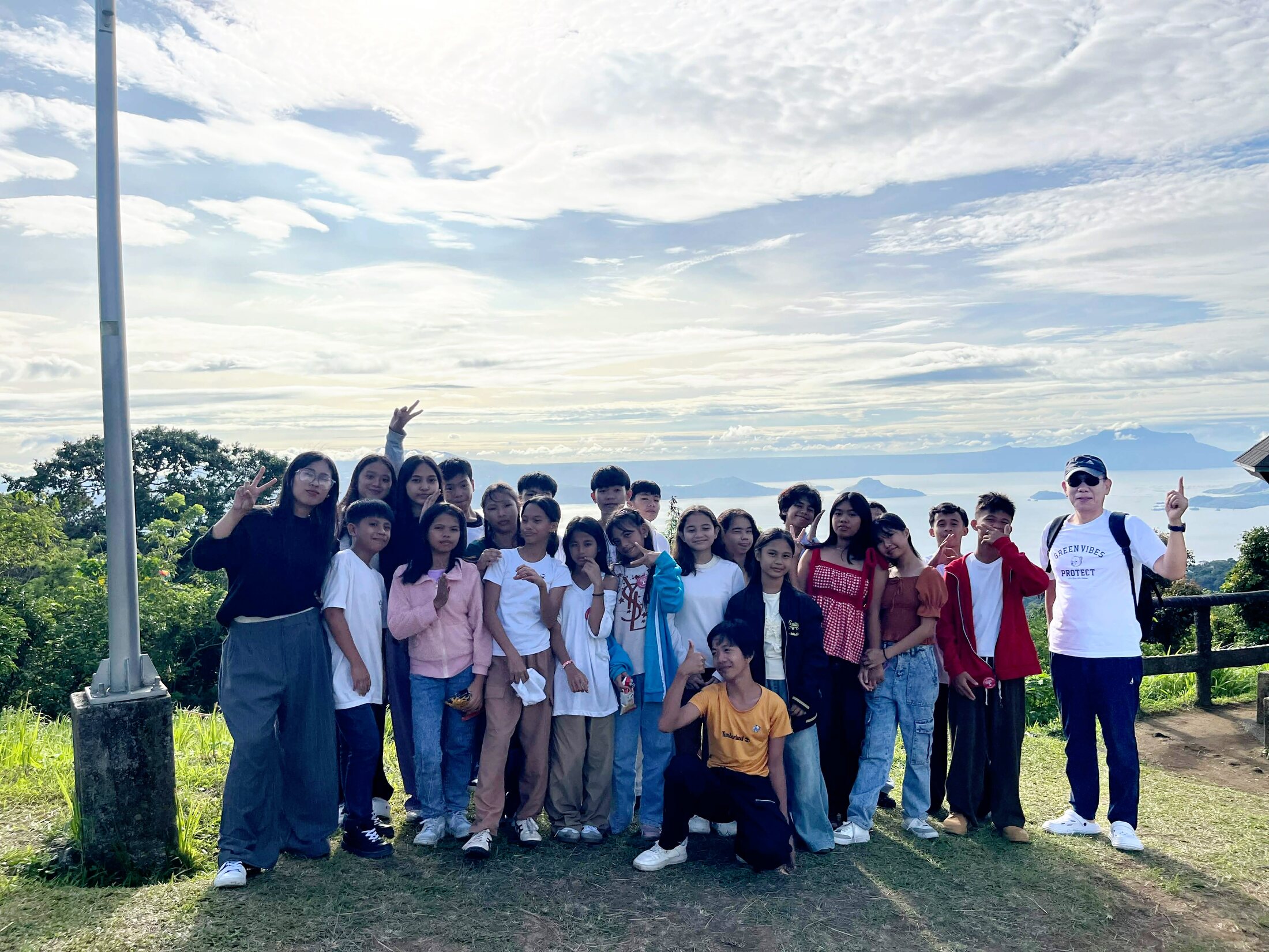 A youth group posing together during an outdoor fellowship